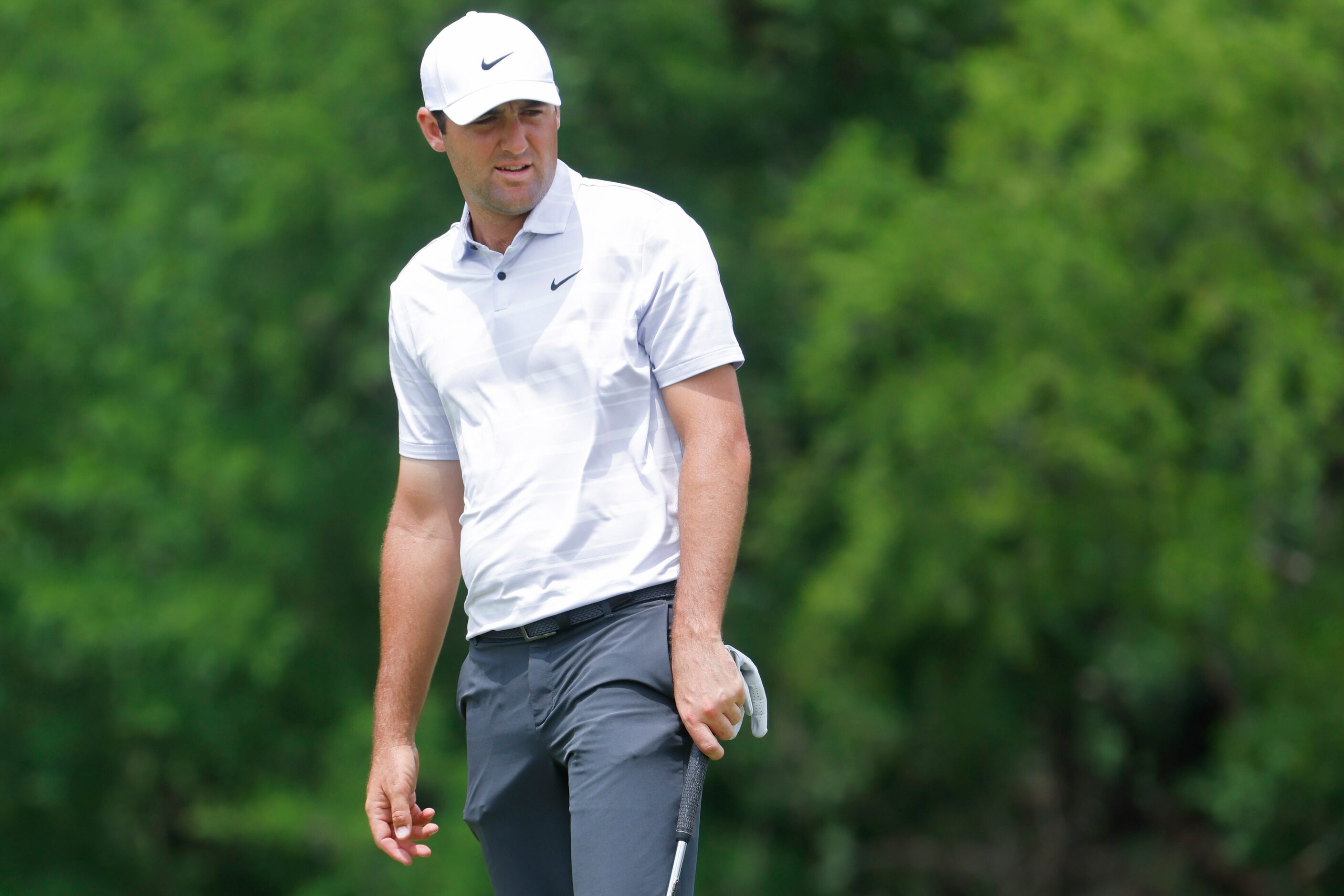 Scottie Scheffler of United States watches as he putts on the ninth hole during the second...