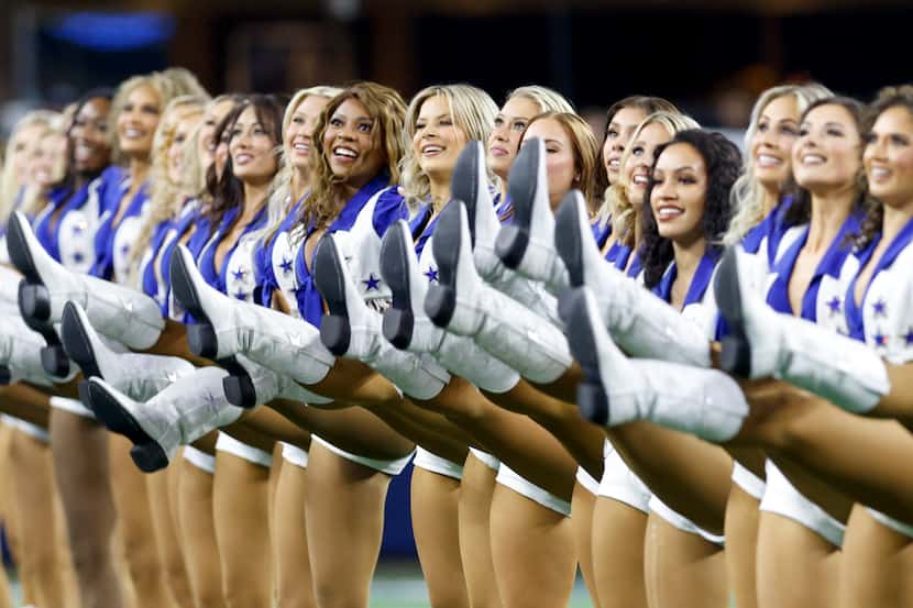 The Dallas Cowboys Cheerleaders perform before an NFL game against the Detroit Lions,...