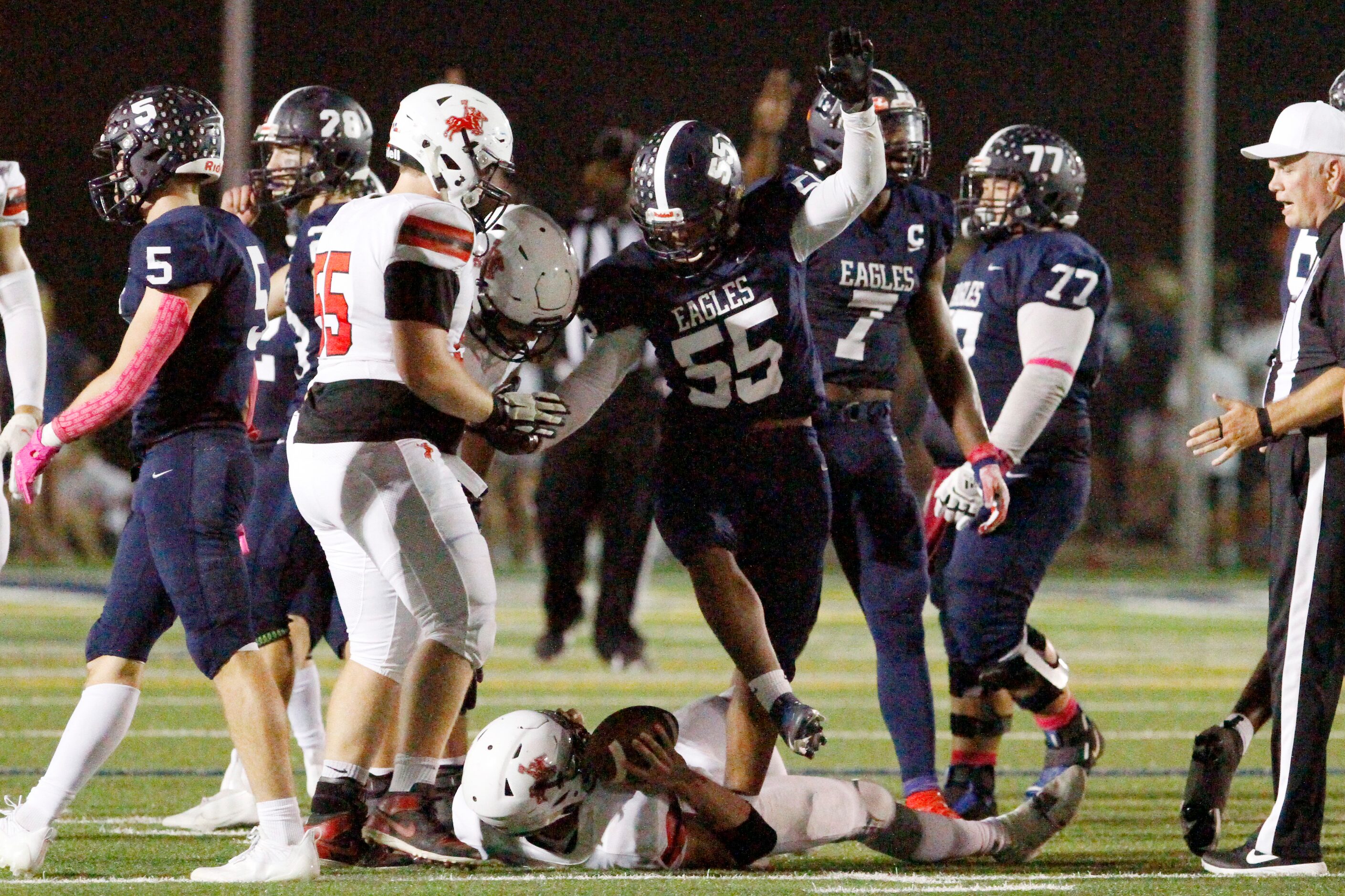 Episcopal School of Dallas junior linebacker Justin McCray (55) raises his arms in...