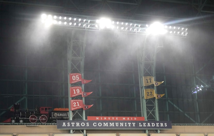 Rain blows in from the windows as a severe thunderstorm hit before a baseball game between...