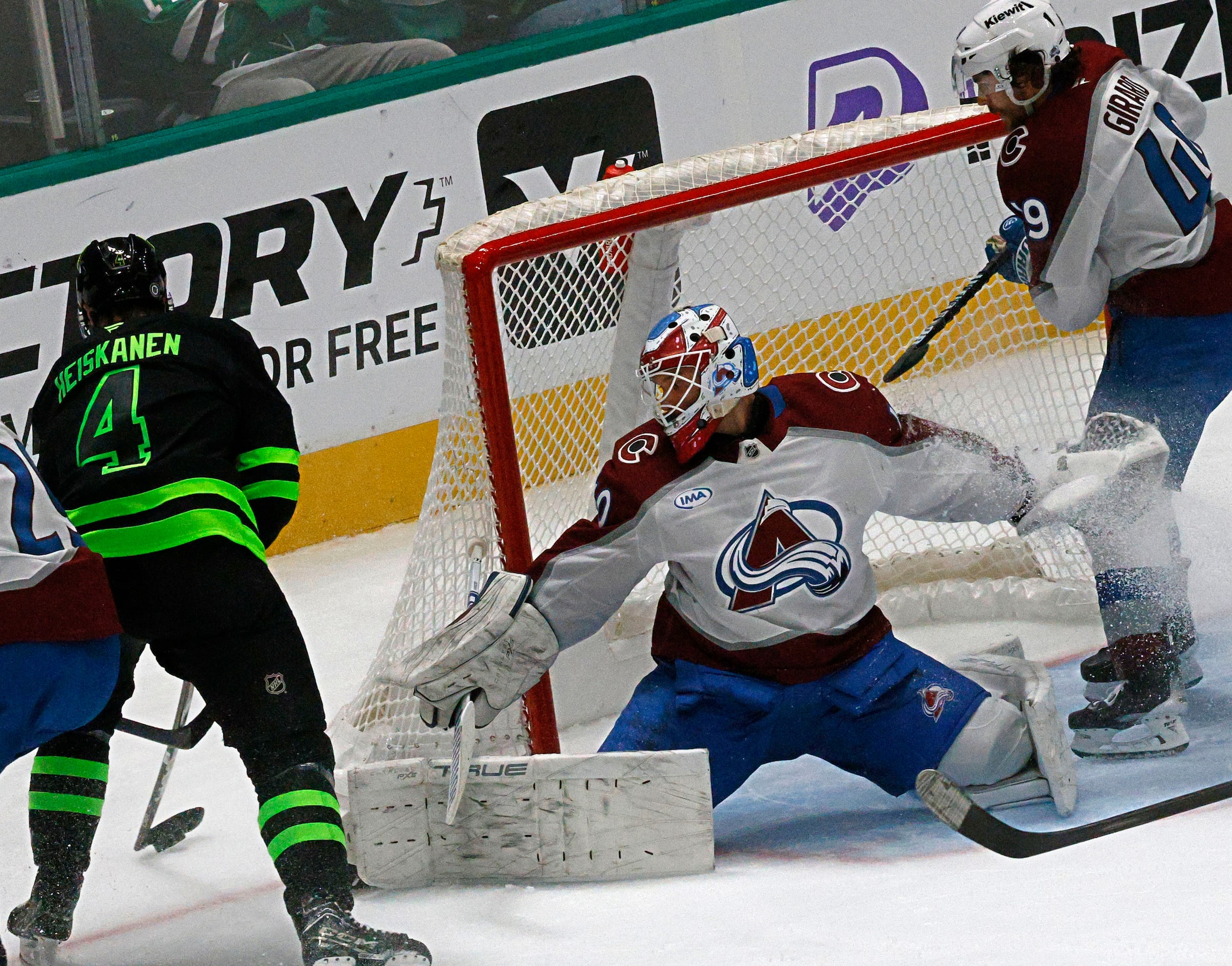 Dallas Stars defenseman Miro Heiskanen (4) tries to shoot against Colorado Avalanche...