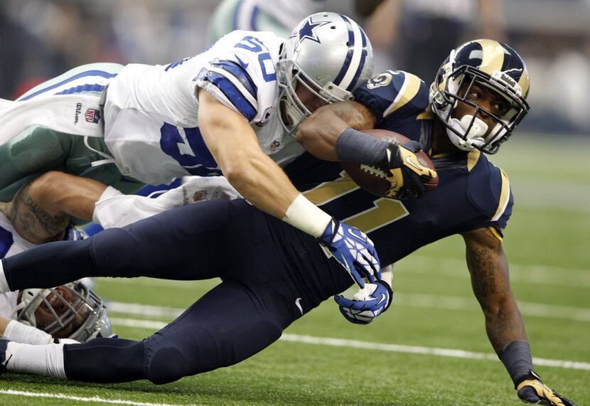 Dallas Cowboys middle linebacker Sean Lee (50) tackles St. Louis Rams wide receiver Tavon...