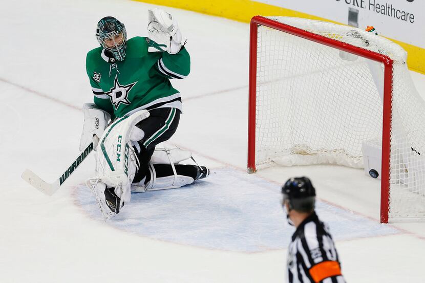 Dallas Stars goaltender Ben Bishop is unable to stop a shot from Colorado Avalanche forward...