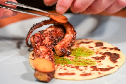 Chef RJ Yoakum prepares grilled Spanish octopus at Georgie in Dallas.