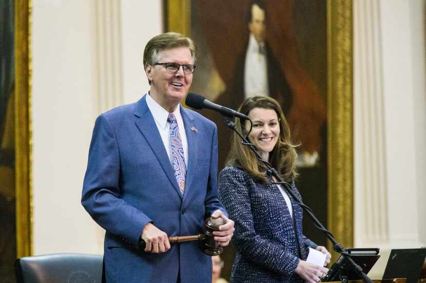 Lt. Governor Dan Patrick smiles as Senator John Whitmire, not pictured, makes a motion to...