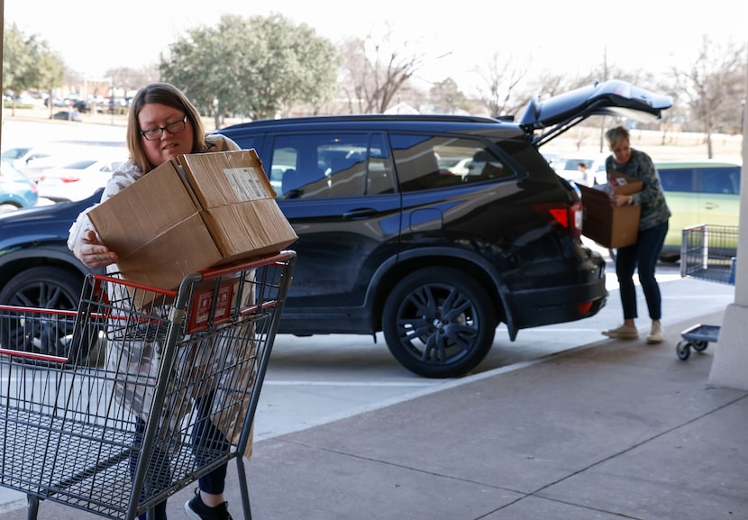 Whitney Hicks (left) and Julie Coalson from Christie Elementary School in Frisco drop...