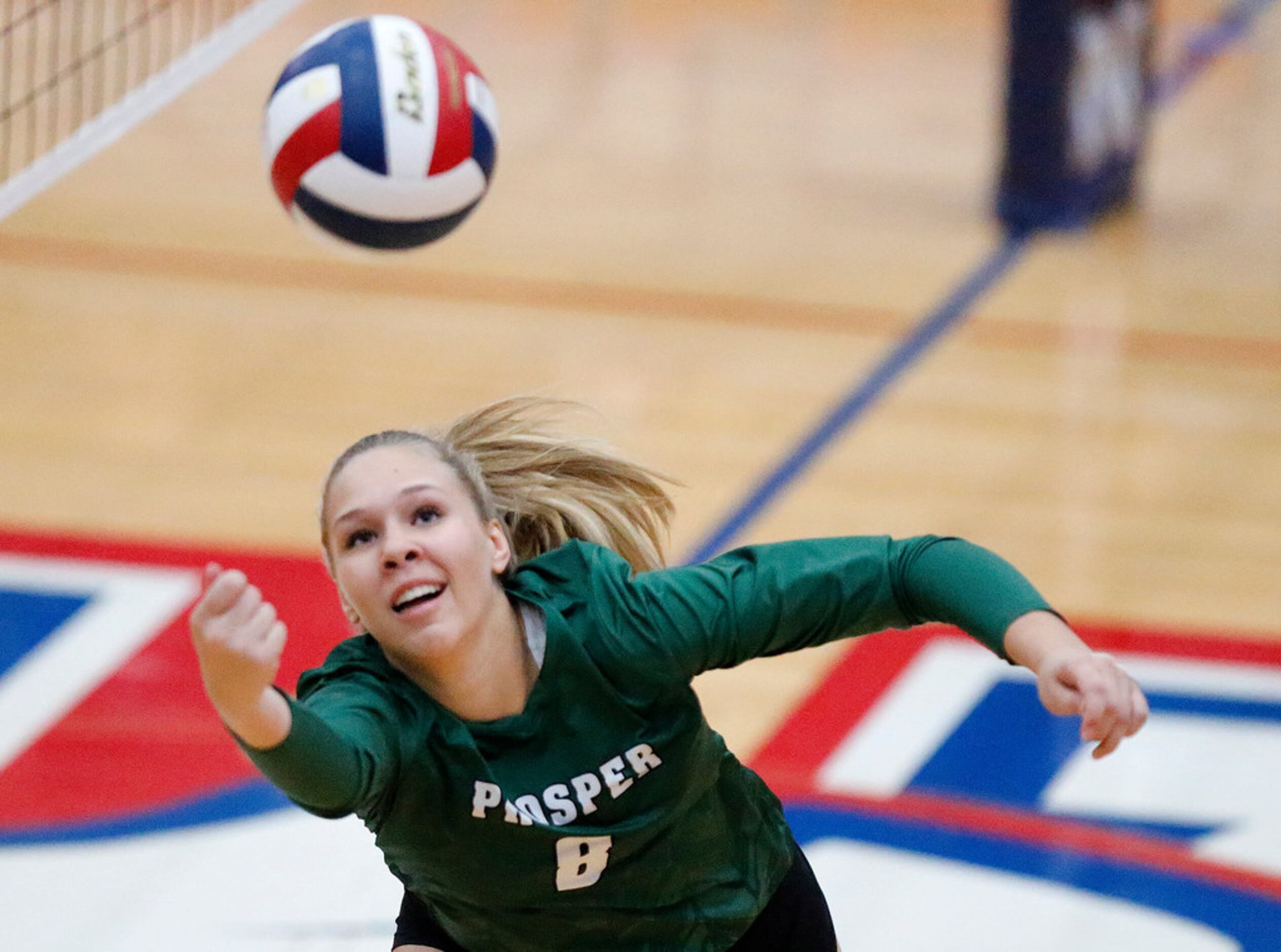 Prosper High School setter Jazzlyn Ford (8) attempts to keep the point alive during game one...