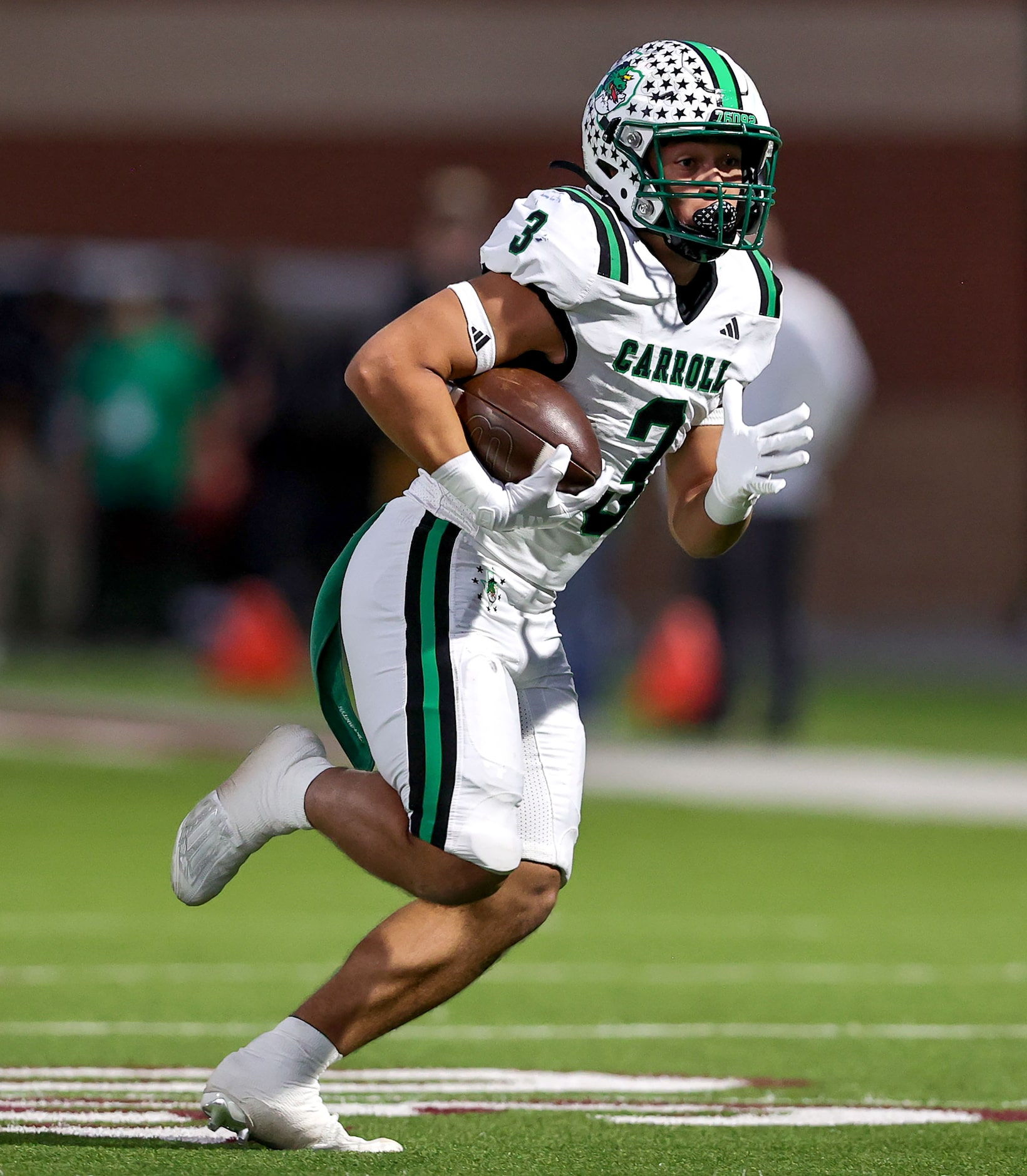 Southlake Carroll running back Davis Penn has some running room against Justin Northwest...