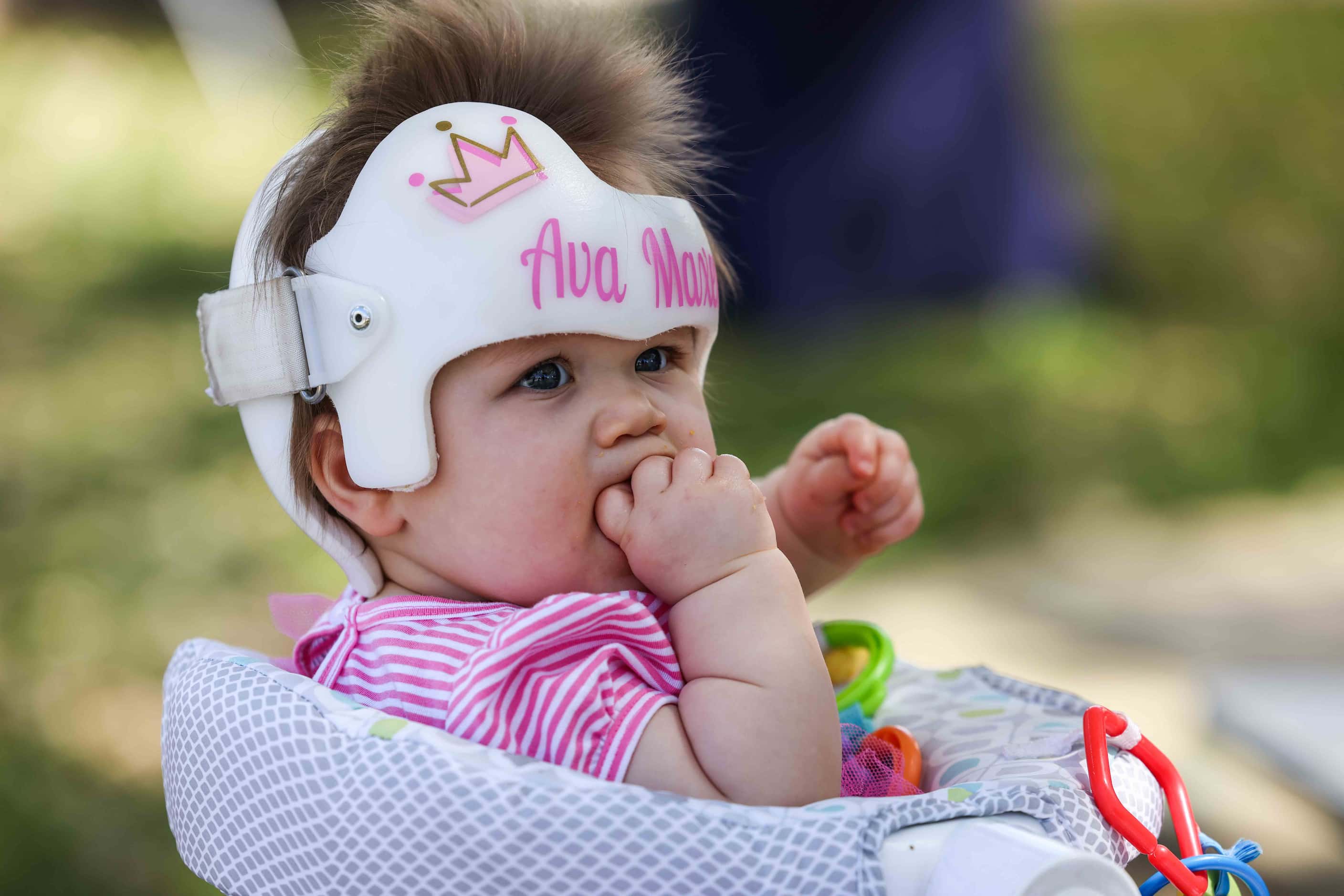 Ava Smith sits on her baby chair outside the Globe Life Field in Arlington, Texas on Monday,...