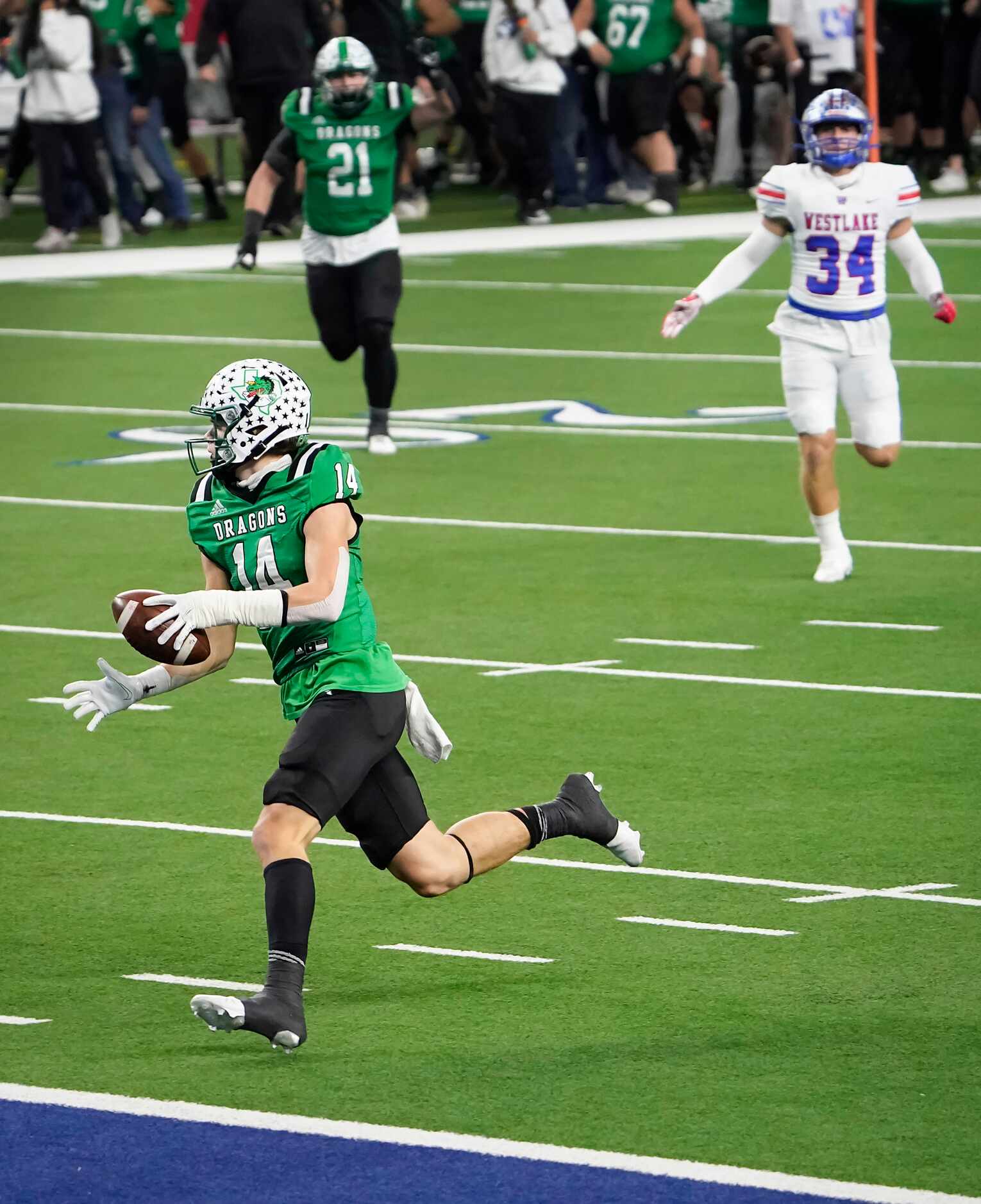 Southlake Carroll wide receiver Brady Boyd (14) scores on a 49-yard touchdown play during...