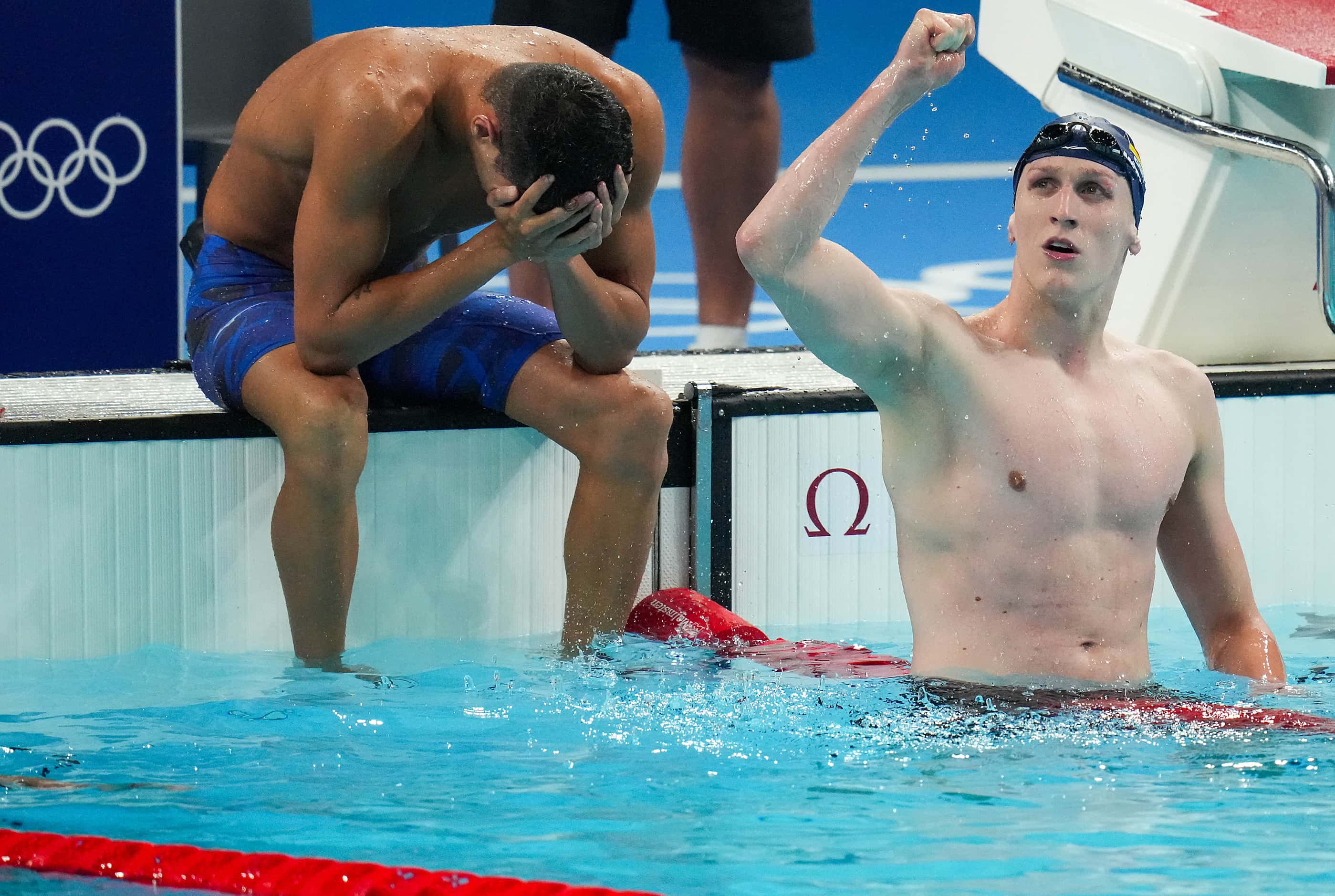 Lukas Maertens of Germany (right) celebrates after winning the men's 400-meter freestyle...