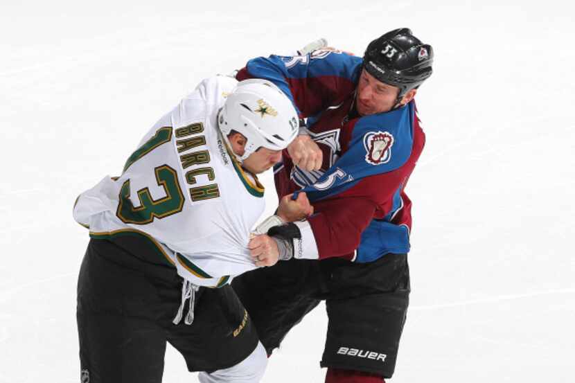 Krystofer Barch (13) fights with Colorado's Cody McLeod during the Stars-Avalanche game on...