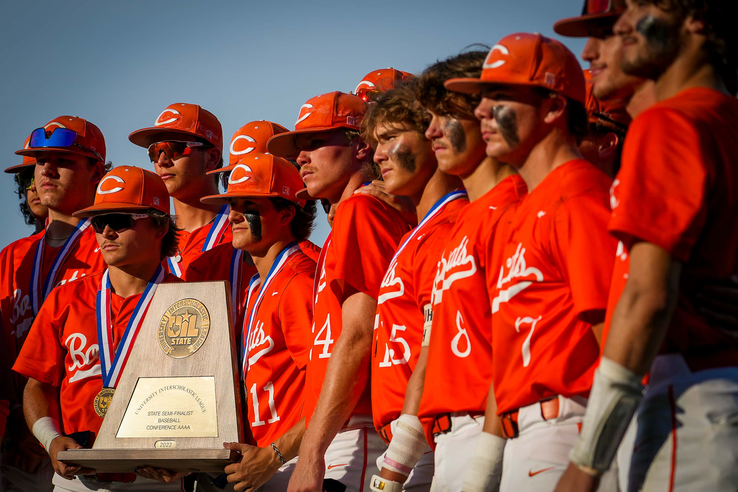 Celina players pose with the state semi-finalist trophy after a loss to Sinton in a UIL 4A...
