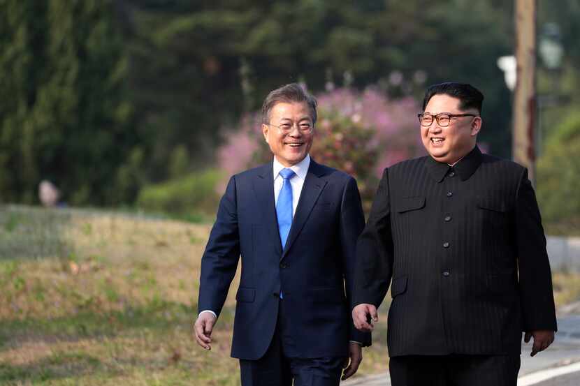 North Korean leader Kim Jong Un (right) and South Korean President Moon Jae-in walk together...