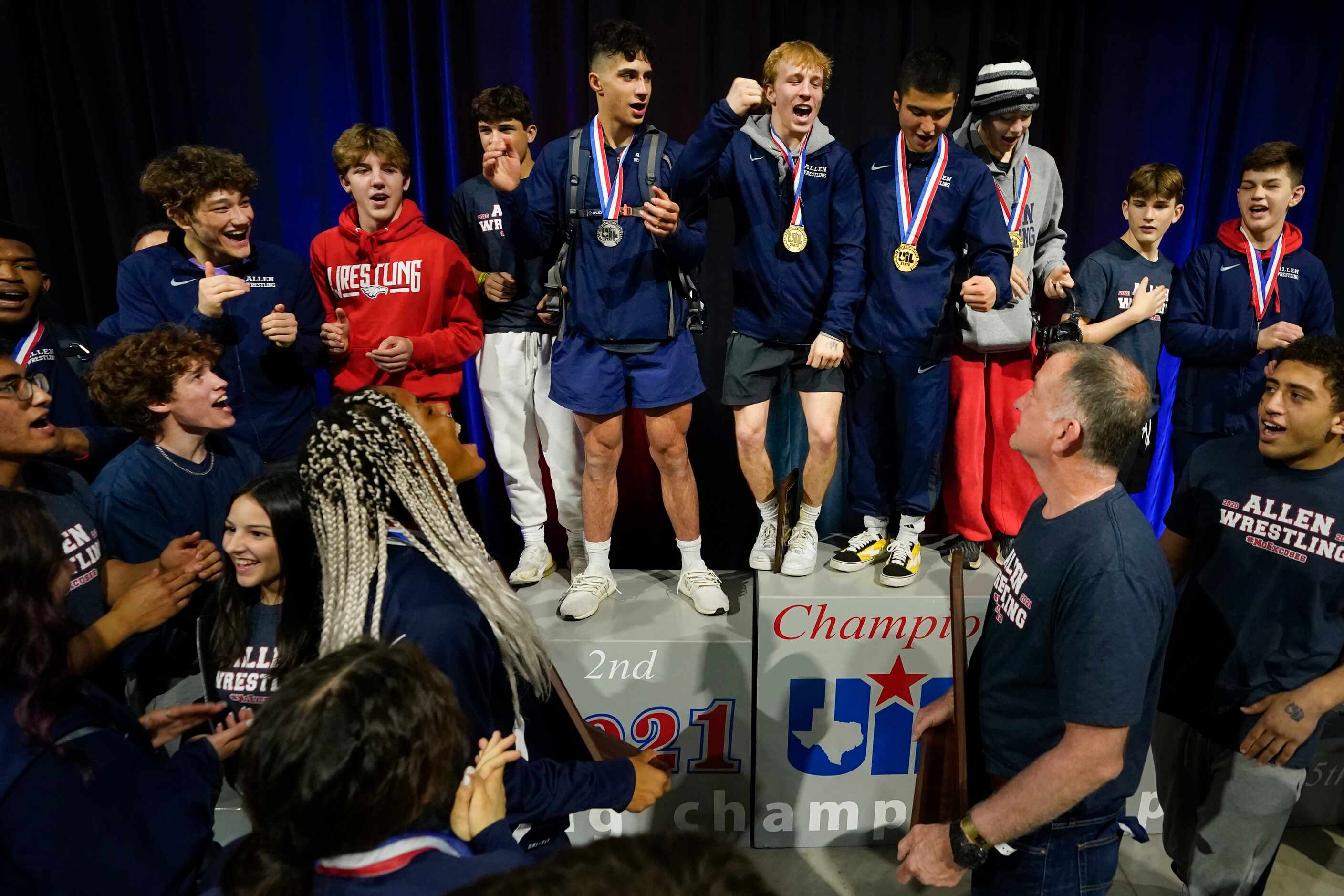Braxton Brown of Allen (top center) leads the combined boys and girls teams in celebration ...