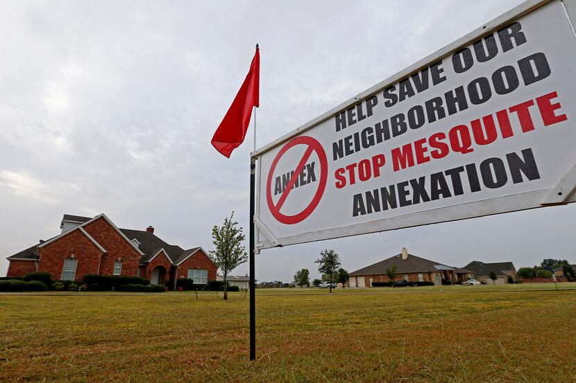 A sign is seen on the front yard at 10474 Walnut Lane near Forney on Sept. 28. Many Kaufman...