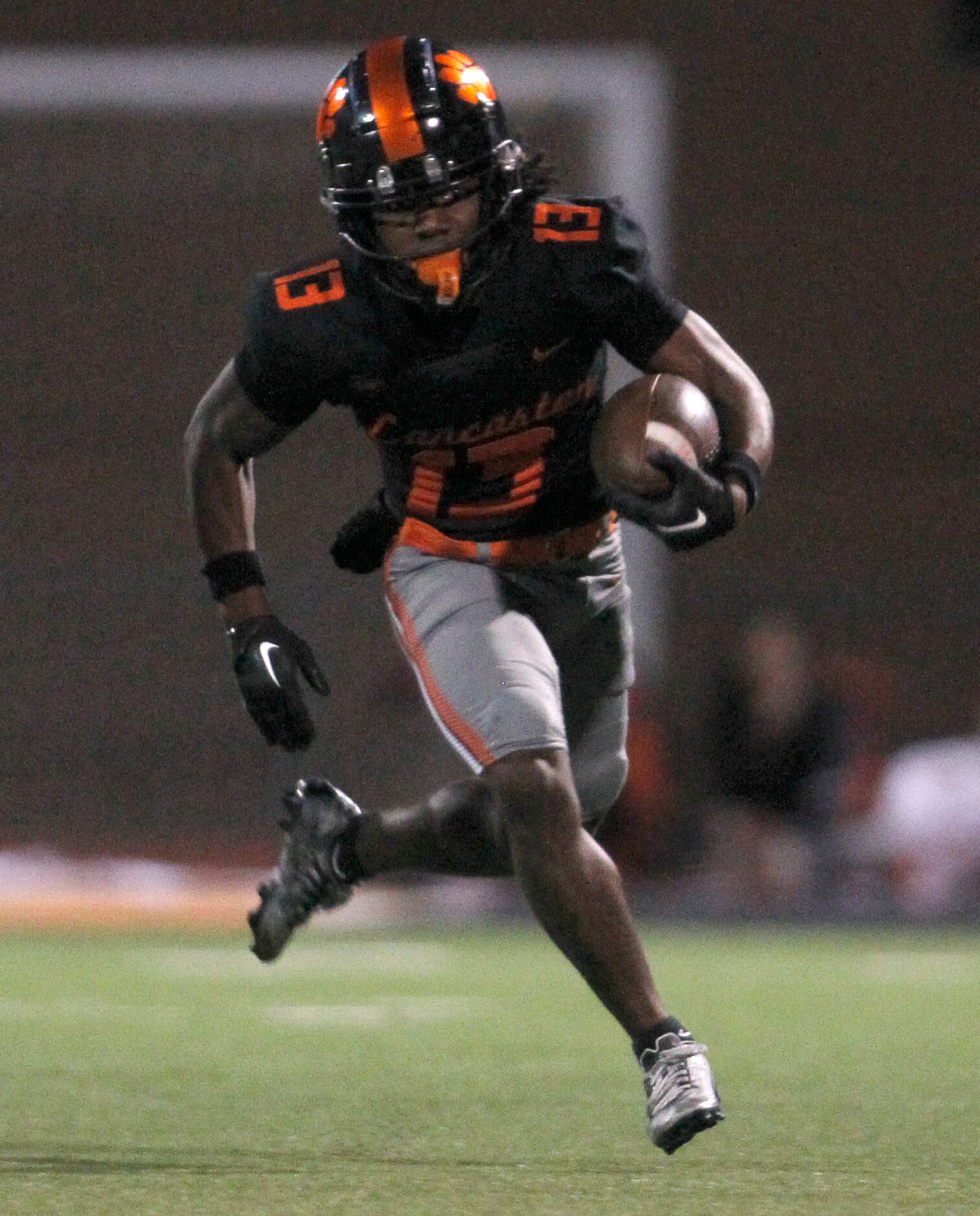 Lancaster receiver Jerbrandin Henderson (13) rambles into the Lufkin secondary during first...