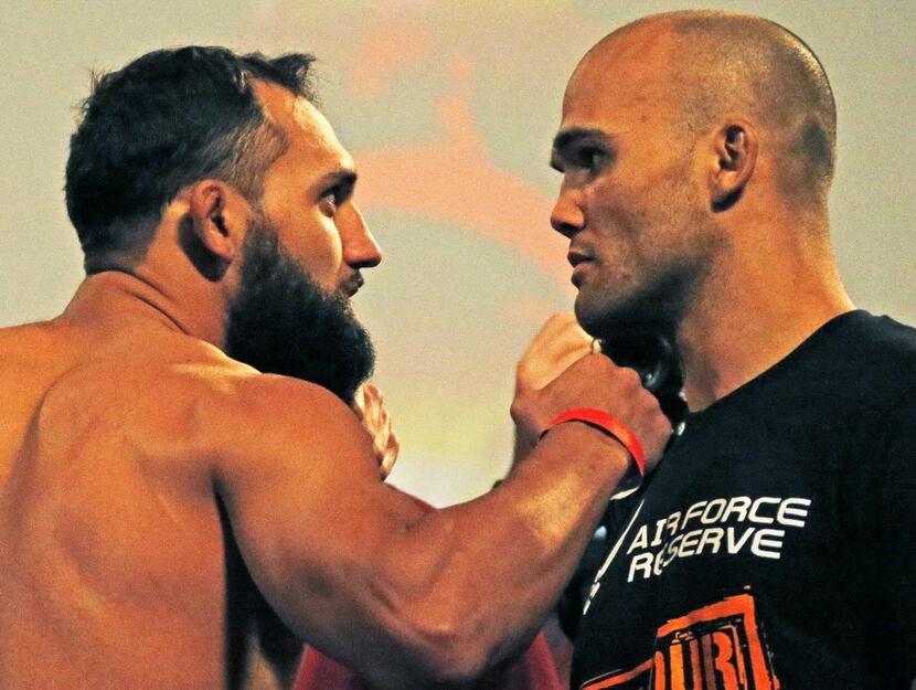 Johny Hendricks poses with opponent Robbie Lawler during UFC weigh-ins at Gilley's in Dallas...