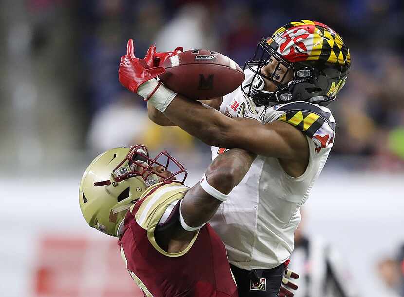 DETROIT, MI - DECEMBER 26: D.J. Moore #1 of the Maryland Terrapins and Kamrin Moore #5 of...