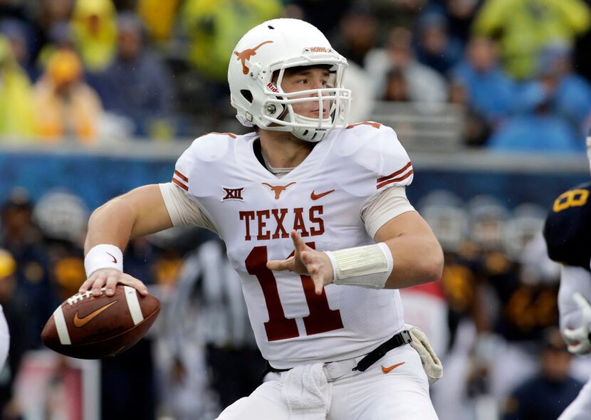 FILE - In this Saturday, Nov. 18, 2017, file photo, Texas quarterback Sam Ehlinger (11)...