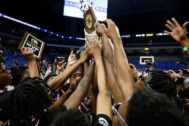 Lancaster celebrates after defeating Killeen Ellison in the UIL Class 5A boys basketball...