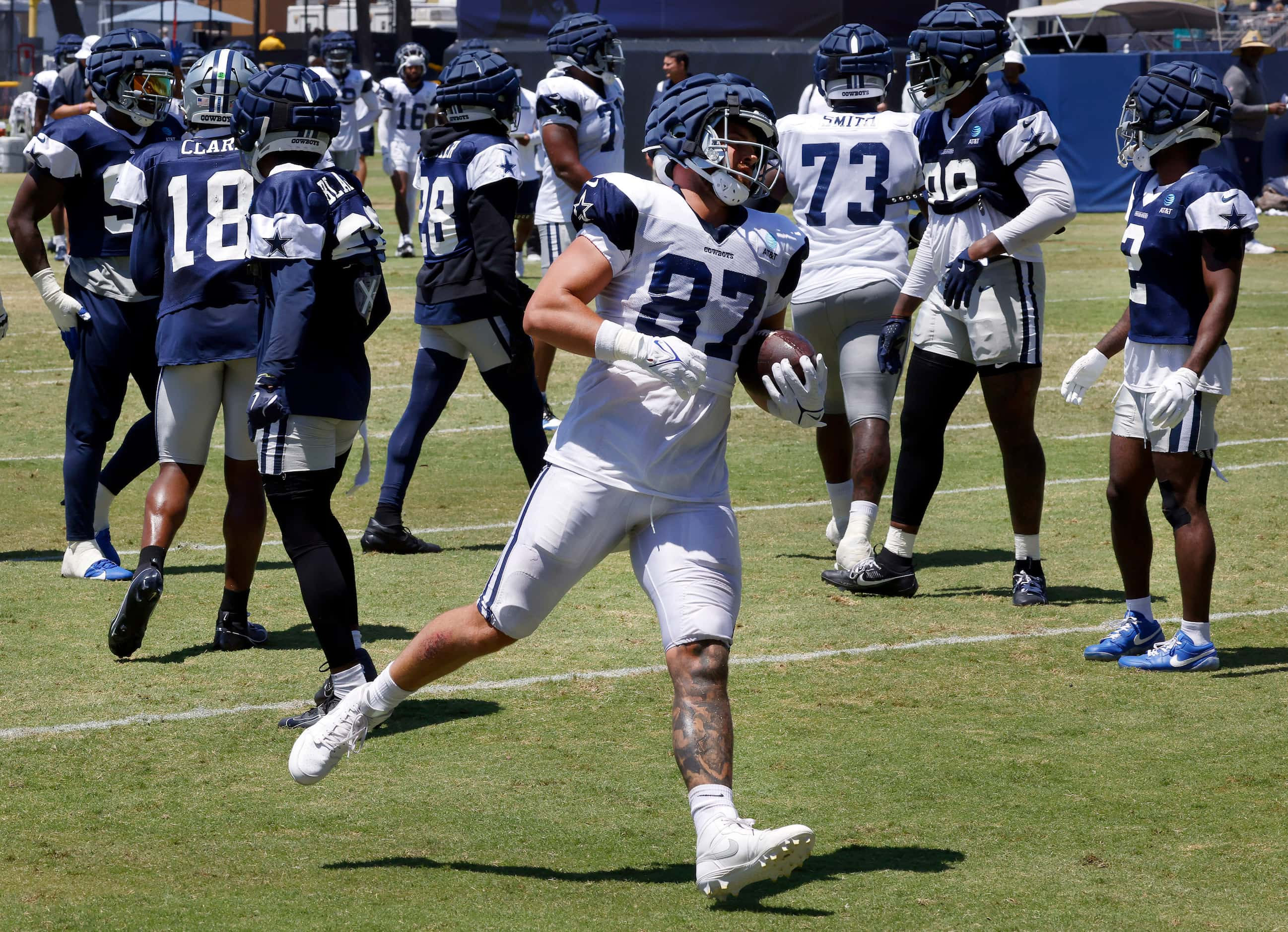 Dallas Cowboys tight end Jake Ferguson (87) finishes off a catch and run during third and...