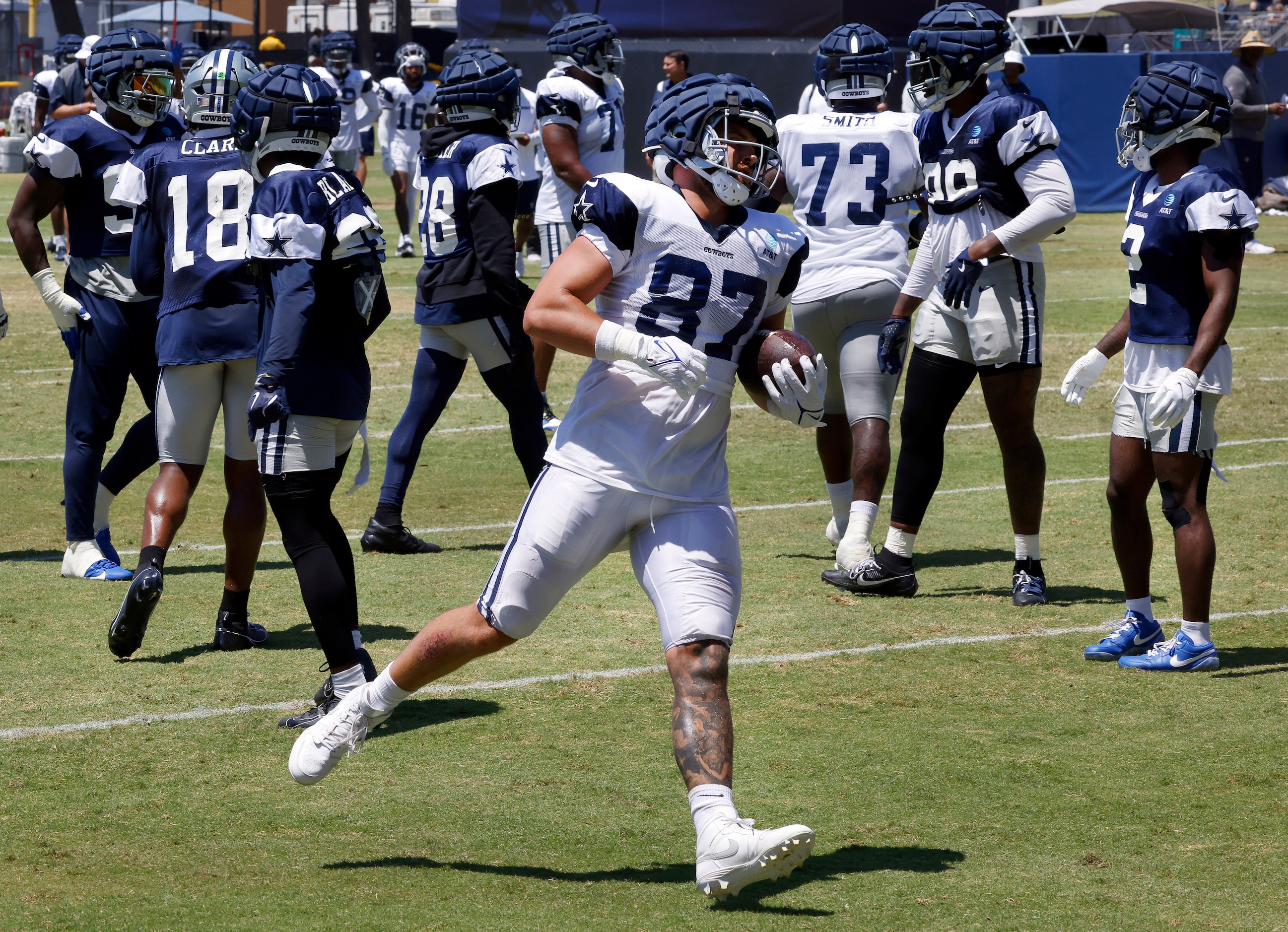 Dallas Cowboys tight end Jake Ferguson (87) finishes off a catch and run during third and...