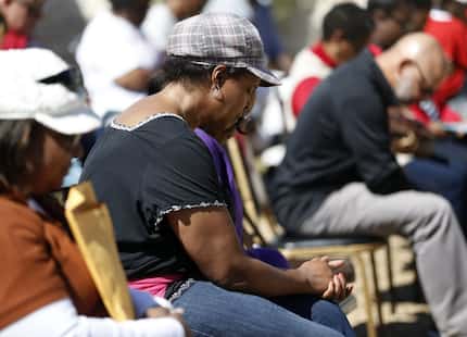 Deanna Keahey, wife of Pastor Eugene Keahey, prayed during a prayer vigil outside Mt. Zion...