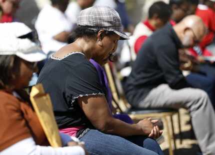 Deanna Keahey, wife of Pastor Eugene Keahey, prayed during a prayer vigil outside Mt. Zion...