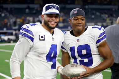 Dallas Cowboys quarterback Dak Prescott (4) and Dallas Cowboys wide receiver Amari Cooper...