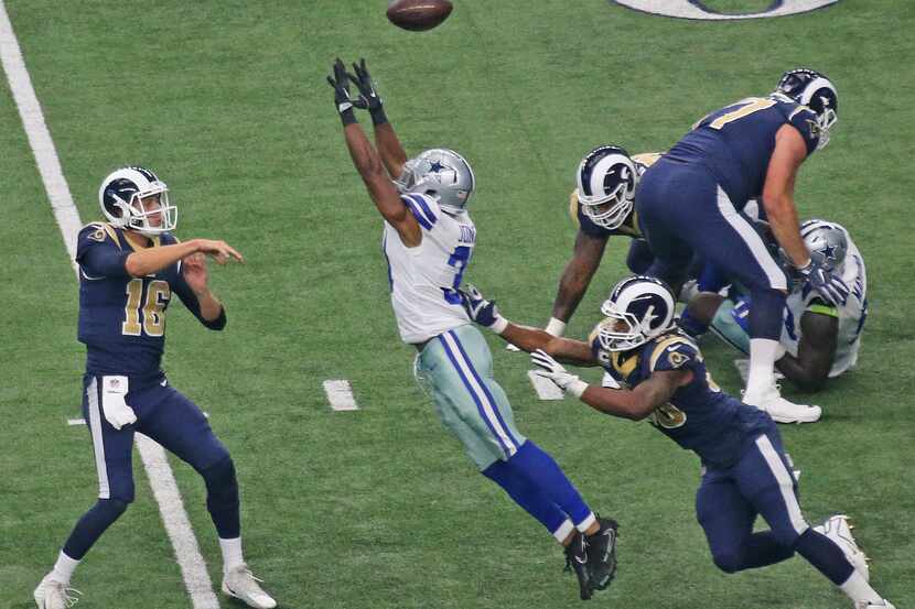 Dallas Cowboys free safety Byron Jones (31) pressures Los Angeles Rams quarterback Jared...