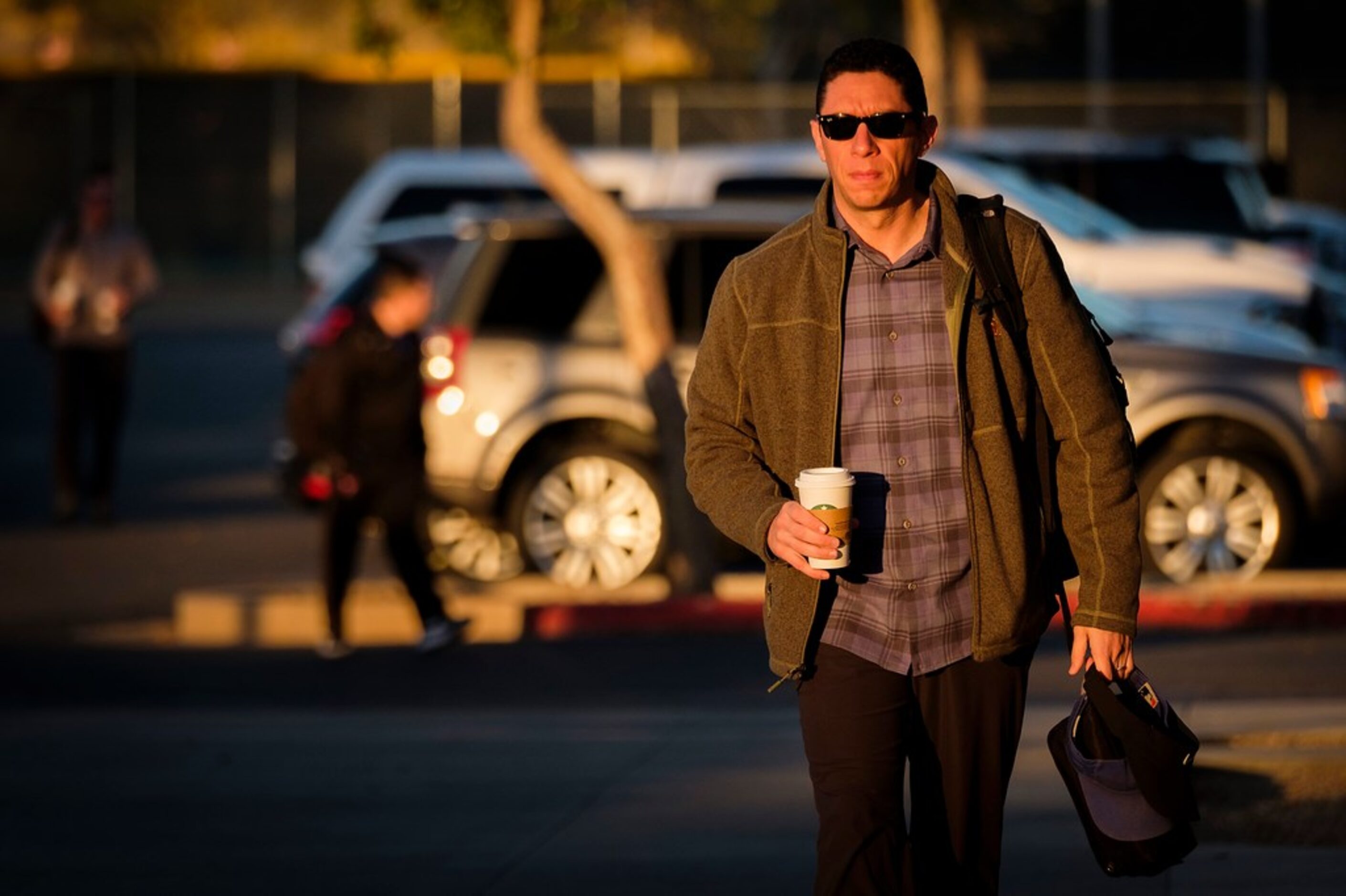 Texas Rangers general manager Jon Daniels arrives with the first rays of morning sunlight as...