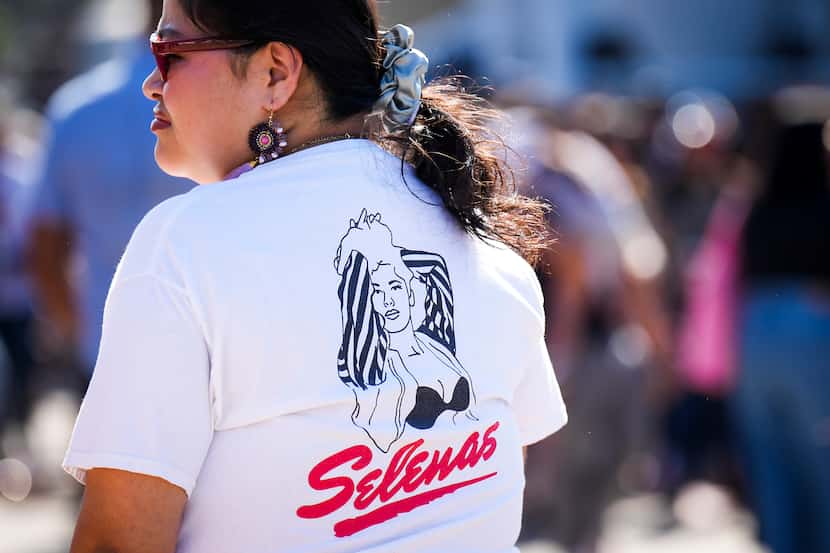 A woman wears a t-shirt honoring Tejano singer Selena Quintanilla-Pérez.