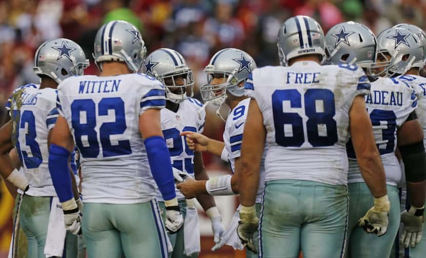 Dallas Cowboys quarterback Tony Romo (9) directs the team as they started their game-winning...
