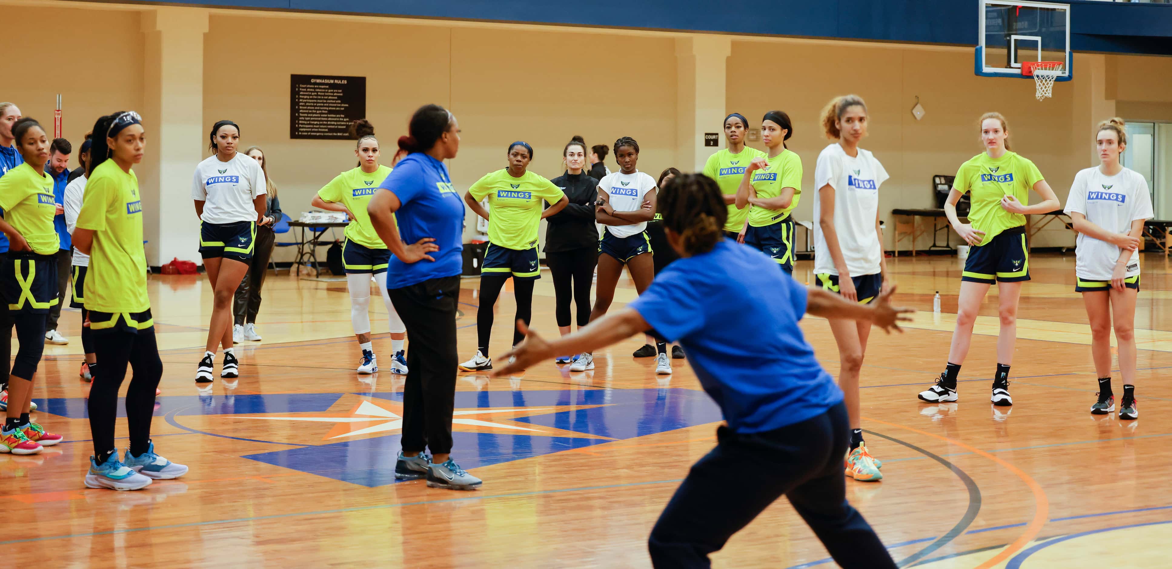Dallas Wings players follow as head coach Vickie Johnson instructs during a training camp...