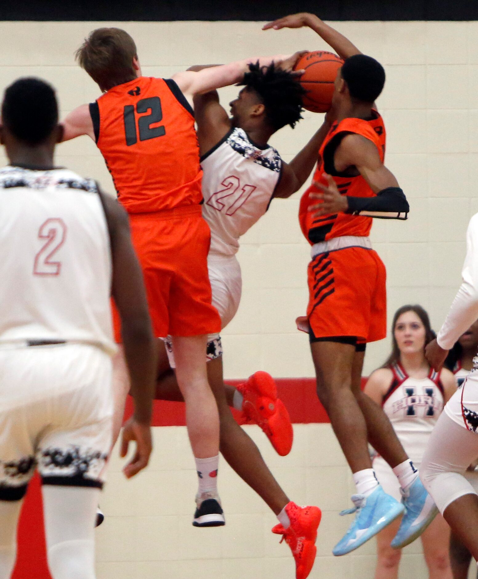 Mesquite Horn's Donovan Payne (21) draws a foul from the double coverage of Rockwall...