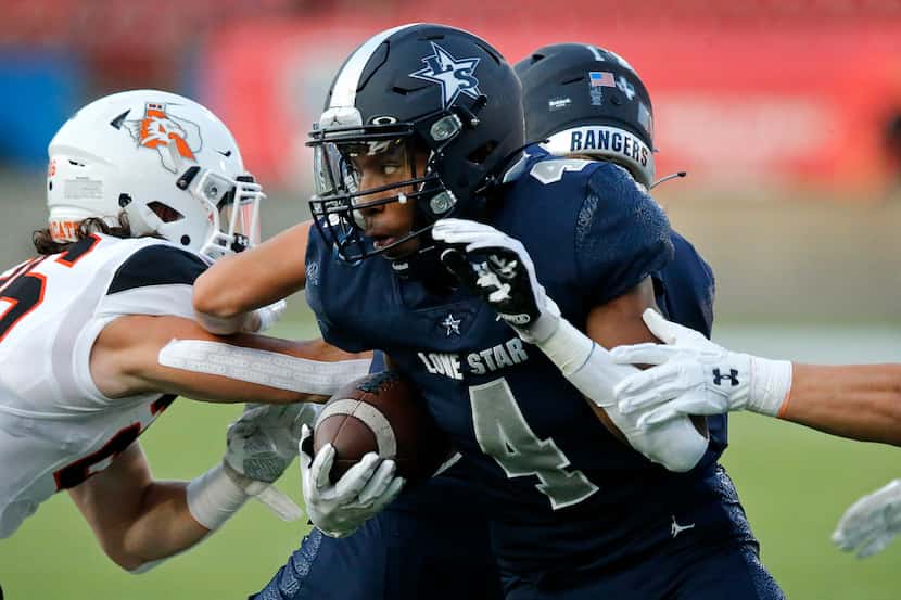 Frisco Lone Star's Jaylon Braxton (4) looks for room to run after making a catch against...
