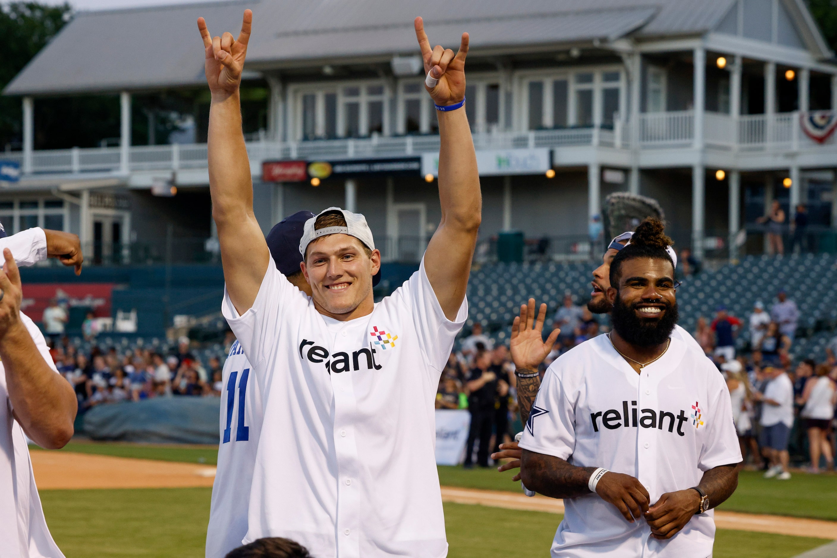 Dallas Cowboys linebacker Leighton Vander Esch raises his arms in celebration after being...