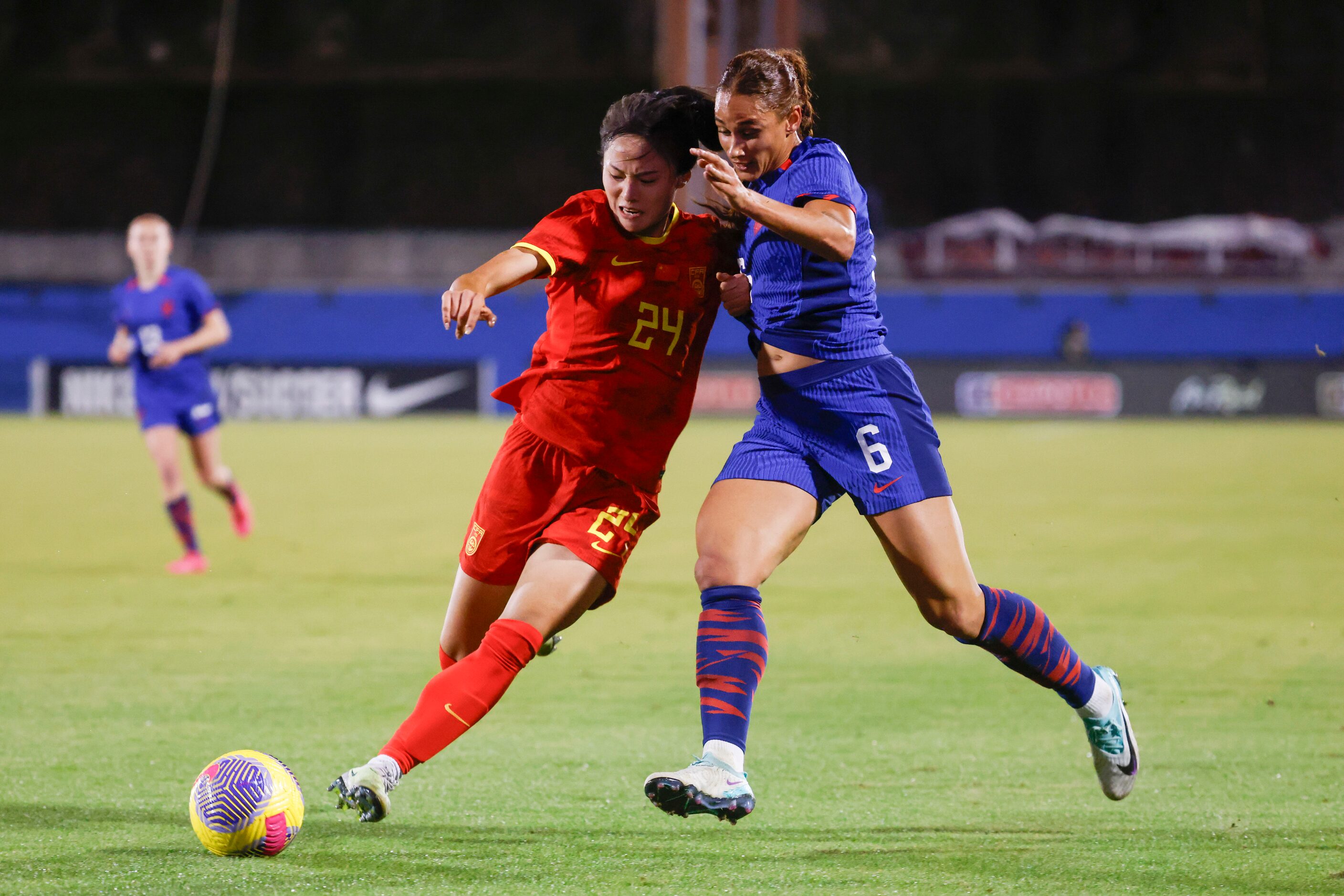 China’s Jin Kun (left) battles for possession against United State’s Lynn Williams during...