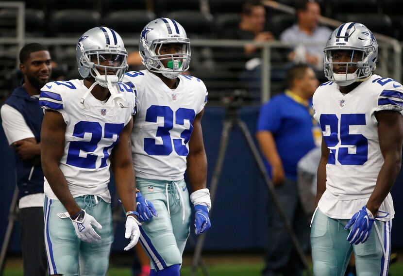 FILE - In this Oct. 8, 2017, file photo, Dallas Cowboys' Jourdan Lewis (27), Chidobe Awuzie...