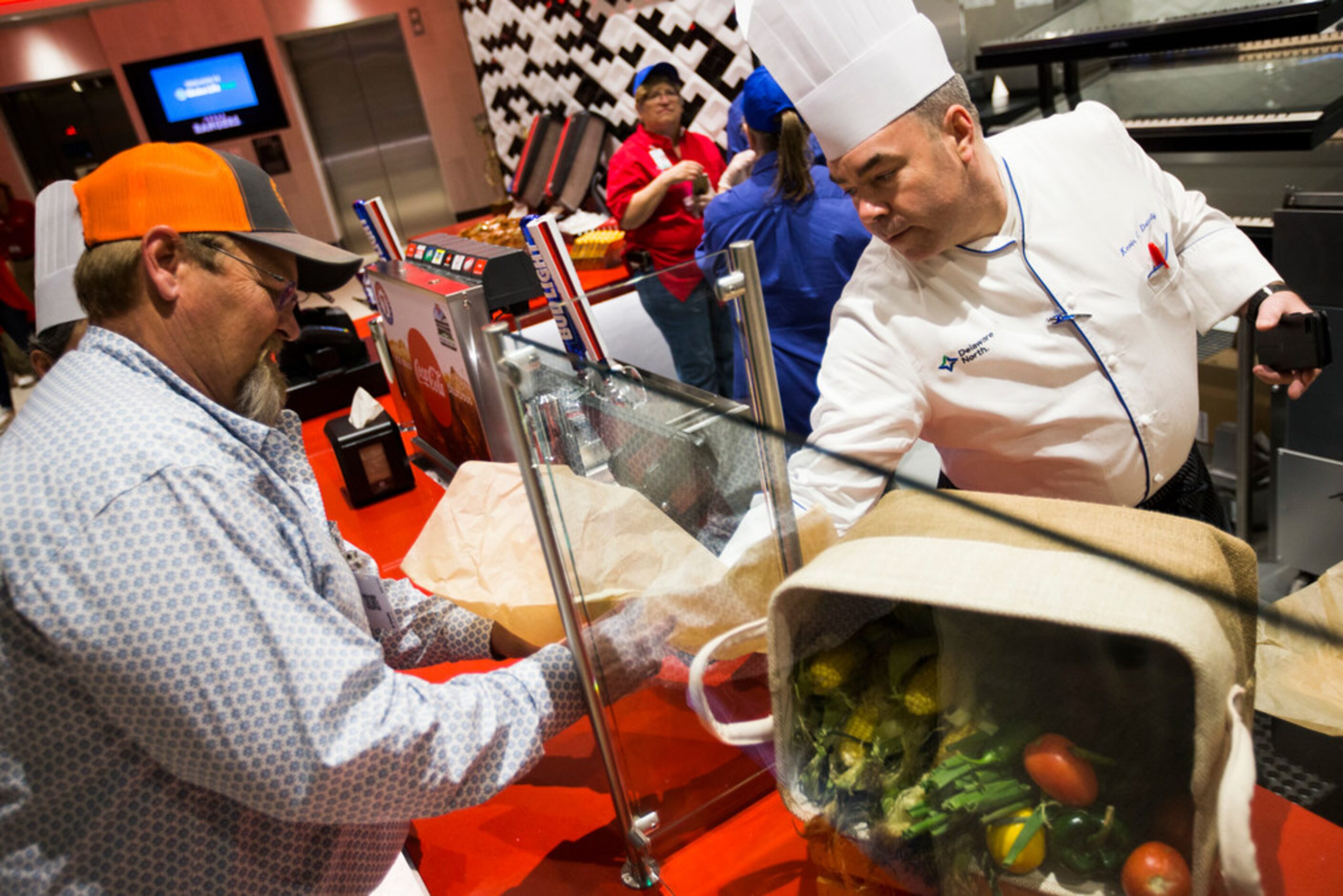 David Barton (left) samples a tortilla made by Kevin Doherty (right) at Oppo Taco, a...