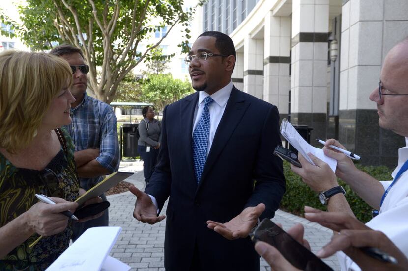 Chris Chestnut (center) spoke to reporters in Florida on May 2, 2012.