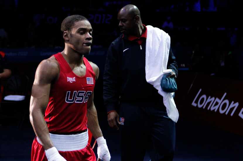 USA's Errol Spence exits the arena after losing to Russia's Andrey Zamkovoy during a...