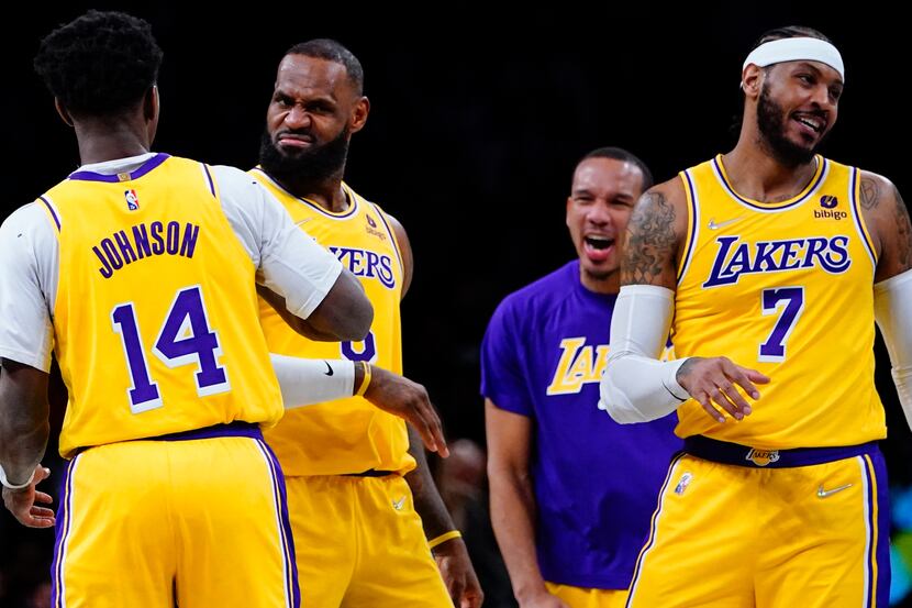 Los Angeles Lakers' LeBron James (6) celebrates with Carmelo Anthony, right, and Stanley...