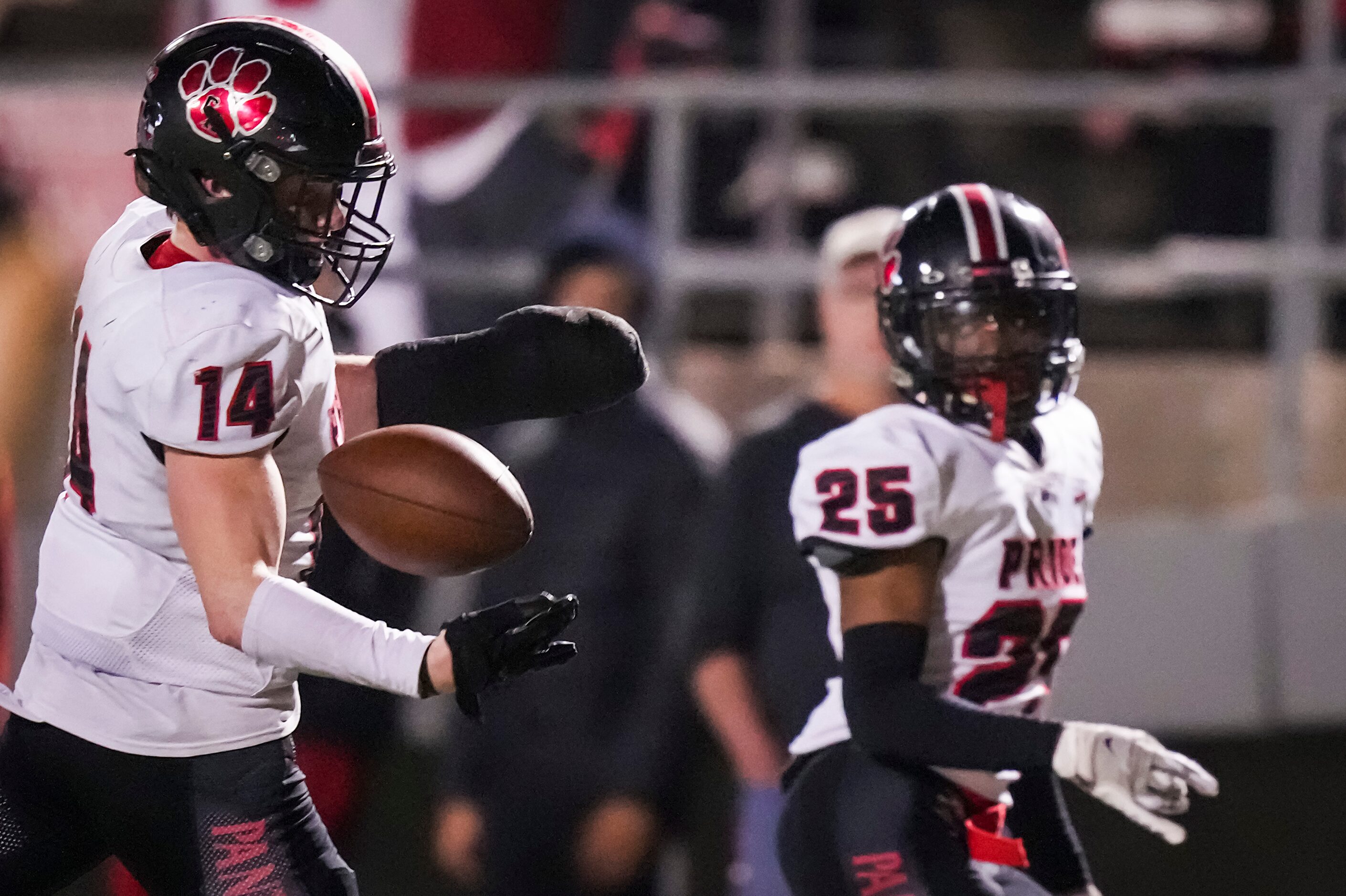 Colleyville Heritage defensive back Parker Roe (14) intercepts a pass intended for Mansfield...