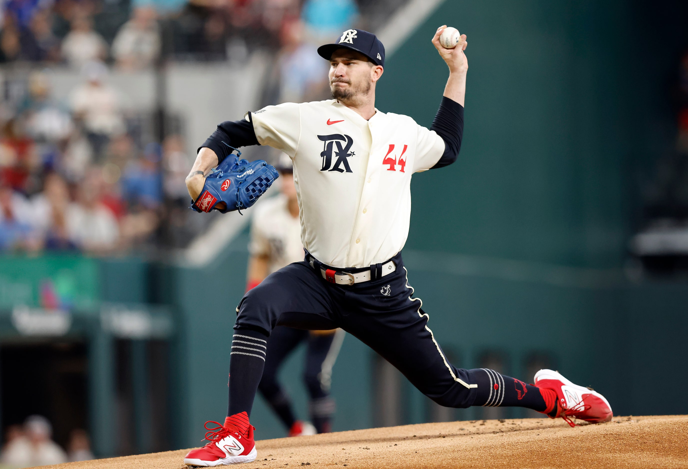 Texas Rangers starting pitcher Andrew Heaney (44) throws against the Cleveland Guardians in...