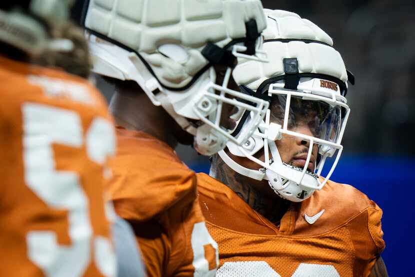 Texas defensive lineman Byron Murphy II (90) attends practice at the Superdome ahead of the...