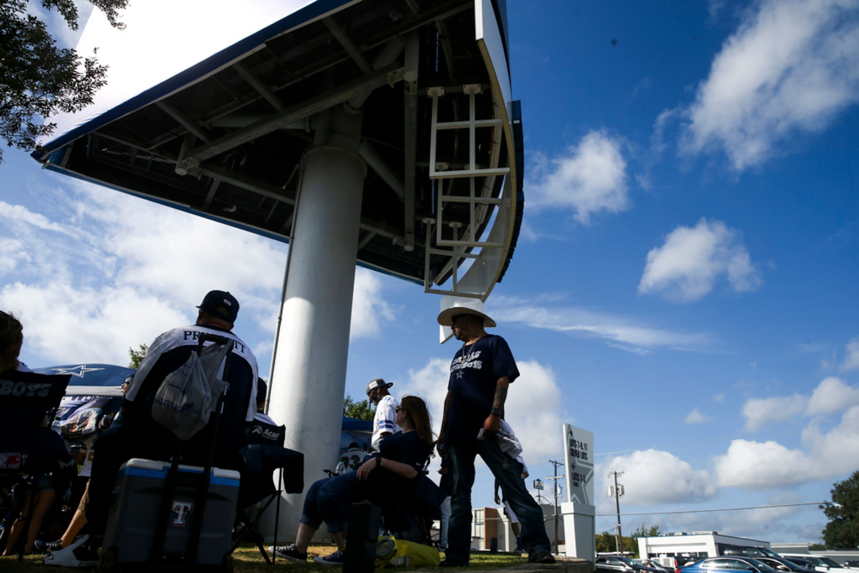 Fans tailgate before an NFL game between the Miami Dolphins and the Dallas Cowboys on...