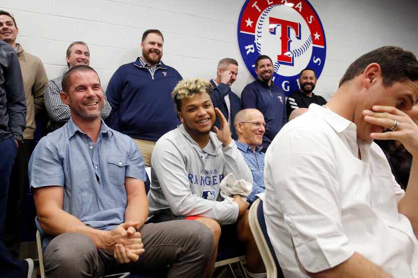 Former Texas Rangers third baseman Michael Young (left) turns red as Adrian Beltre pokes a...