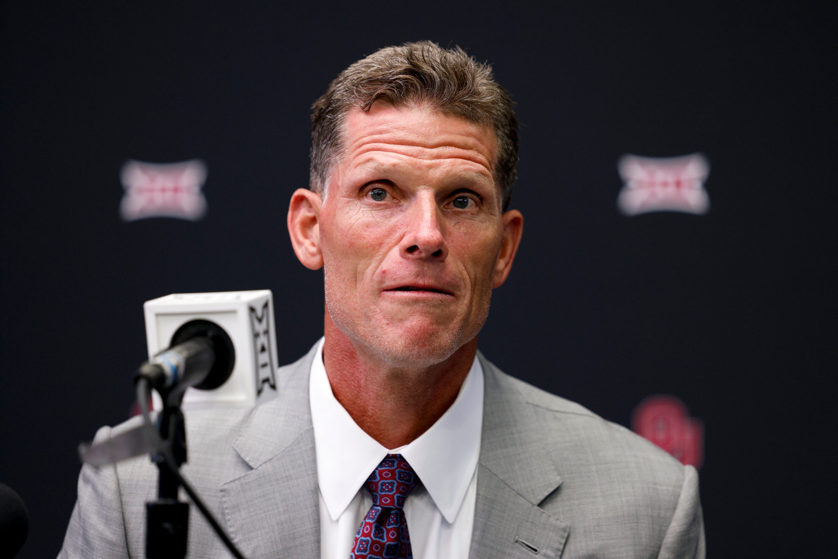 Oklahoma head coach Brent Venables listens to a question from a reporter during the Big 12...